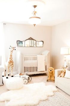 a baby nursery room with white furniture and rugs on the floor is featured in this article