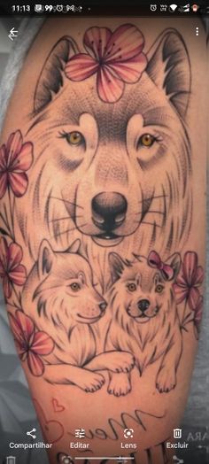 a woman's thigh with an image of two wolfs and flowers on it