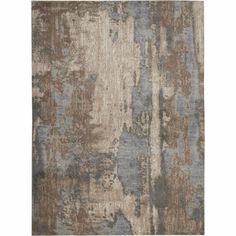 an area rug with various colors and patterns on it, including blue, brown, beige and