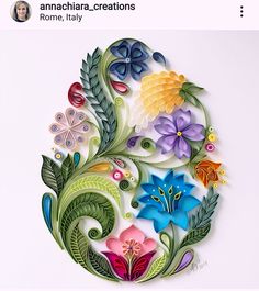 an image of paper art with flowers and leaves