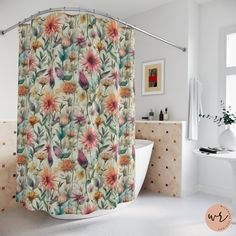 a shower curtain with flowers on it in a bathroom