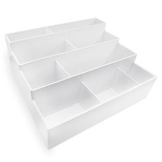 three white plastic bins stacked on top of each other with dividers in the middle