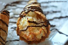 chocolate covered pastry sitting on top of a white plate