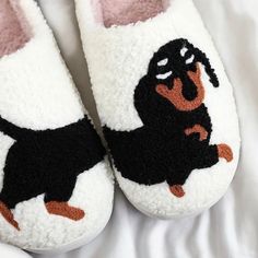 Looking for cute, cozy, warm slippers? These slippers are the comfiest shoes you'll ever wear. Providing cushion and comfort for everyday wear! 🐶Warm & Cozy: Perfect for the chilly months and keeping your feet nice and warm!   🤍Easy Wear: Closed toe and durable bottom for unlimited use.   🐕Cute Dachshund Design: These shoes display a dog design that adds a cute touch to any wear! 🤎Durable: Made with high quality, softest materials for everyday wear.  Nonslip, thick design allows you to wear these slippers outdoors as well! All sizes at US women's, feel free to message me with any questions! Slippers Cartoon, Funny Slippers, Shoes Display, Cow Slippers, Black Cat Plush, Dog Slippers, Cute Fluffy Dogs, Dachshund Design, Cute Egg