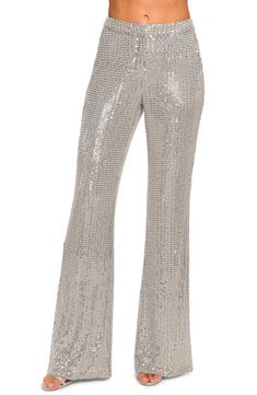 Drip in the dazzle with wide leg party pants covered in shiny sequins. 33 1/2" inseam; 25" leg opening; 10 front rise; 15" back rise (size 8) Lined 95% polyester, 5% spandex Dry clean Imported Elegant Sequined Bottoms For Gala, Chic Embellished Festive Pants, Glamorous Embellished Pants For Festive Season, Glamorous Embellished Pants For Festive Occasions, Glamorous Embellished Festive Pants, Flare Sequin Pants For Night Out, Fitted Sequin Bottoms For Gala, Flared Sequin Pants For Night Out, Flare Pants With Sequins For Night Out