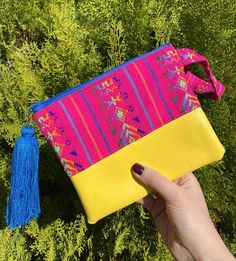 This fun and colorful cambaya bag is perfect to carry all of your essentials! Perfect for toiletries, makeup or to organize small items in your purse/backpack!These bags are handmade with Cambaya, a traditional Mexican fabric, and vinyl, a durable fabric that is easy to clean.Each one has a zipper closure and a tassel hanging from the zipper to add an extra touch of color & joy! This will make a great stocking filler or secret Santa gift!Dimensions: approximately 7.5 in x 6 in**Listing is fo Multicolor Pouch Pencil Case For Daily Use, Portable Multicolor Pouch Bag, Yellow Bag With Removable Pouch For Personal Use, Yellow Cosmetic Bag With Removable Pouch For Everyday Use, Pink Tote-style Cosmetic Bag As Gift, Pink Tote Cosmetic Bag As A Gift, Pink Tote-shaped Cosmetic Bag For A Gift, Pink Tote Cosmetic Bag Perfect For Gifts, Multicolor Pouch Clutch With Adjustable Strap