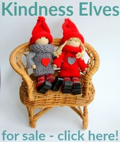 two knitted dolls sitting on a wicker chair with the words kindness elves for sale - click here