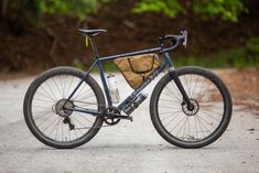 a bicycle parked on the side of a road