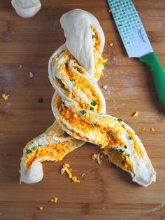 some kind of food that is on top of a cutting board