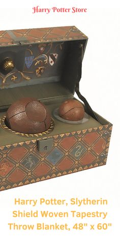 an open harry potter box with two balls in it