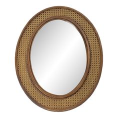 a round wooden mirror on a white wall with a brown frame and wicker pattern around it