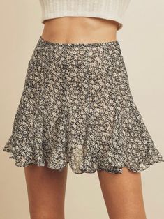 About -Mini Skort -100% Polyester -Zipper Closure -Hand Wash -Dainty Print Step out in style in this dainty print skort. What is a skort you ask? Well... it's the look of a skirt but with the added bonus of shorts. This mini style is easily dressed up with a bootie, but you can pop on sneaker and wear this during the day. We love both the animal print option as well as the dainty daisy print as well. It’s the perfect feminine piece to mix into your wardrobe. Note: This item sold out so fast!! We Black Daisy, Flared Mini Skirt, Talk Of The Town, Shrug Sweater, Sweater Set, Blouse Vintage, Ditsy Floral, Mini Fashion, Striped Tee