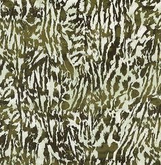 an animal print fabric with brown and white stripes on the top, in shades of green