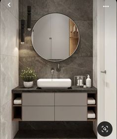 a bathroom with a sink and mirror in it