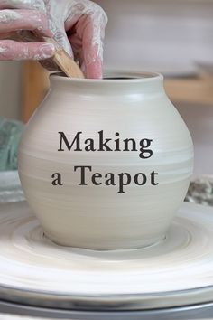 a person is making a teapot out of clay with the words making a teapot on it