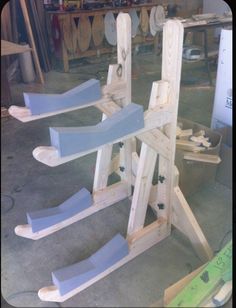 several wooden sleds are being constructed in a workshop