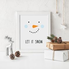 a snowman's face is shown in the frame next to presents