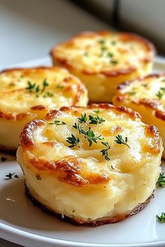 some food is on a white plate with green garnish and sprigs