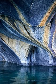 the water is very blue and green with some interesting patterns on it's surface