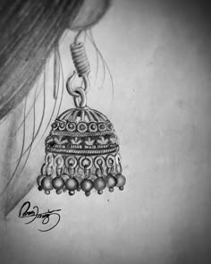 a drawing of a woman's ear with a bell on it