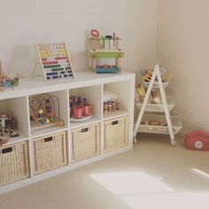 a child's playroom with toys and baskets