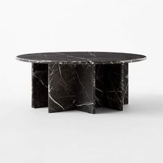 a black marble table with three sections in the middle