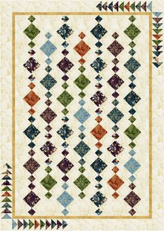 a quilt with many different colored squares on the front and back, along with an ornate border