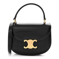 This is an authentic CELINE Shiny Calfskin Triomphe Mini Besace Clea in Black. This stylish shoulder bag is crafted of luxuriously smooth calfskin in black. The bag features a top handle and an adjustable cross-body shoulder strap with polished gold hardware. The flap opens to a black leather interior with flat pockets. Oval Bag, Celine Box, Stylish Shoulder Bag, Celine Bag, Black Cross Body Bag, Flap Bag, Leather Interior, Bag Straps, Pink Bag