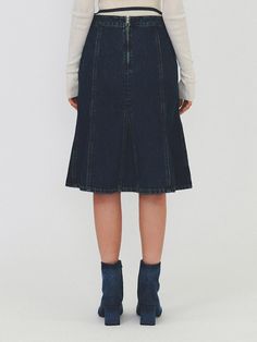 This product is a Gored Denim Midi Skirt that offers a classic denim look with a feminine twist. The gored design creates a flared silhouette, which allows for graceful movement and a timeless appeal. This midi skirt combines the durability of denim with the elegance of a flowy skirt, making it suitable for both casual and more dressed-up occasions. - The skirt features a flared gored design, providing a flattering shape and stylish appearance.- Constructed from sturdy denim, it maintains a casual feel while being suitable for various settings.- Its midi length is both modest and on-trend, offering versatility in footwear options.- Completed with a drawstring waist, it ensures a comfortable, customizable fit. Chic Denim Blue Knee-length Skirt, Chic Denim Flared Skirt, Chic Knee-length Denim Blue Skirt, Classic Denim Skirt In Denim Blue, Classic Denim Blue Skirt, Denim Blue Relaxed Knee-length Skirt, Knee-length Denim Blue Relaxed Skirt, Elegant High Waist Denim Skirt, Elegant High-waist Denim Skirt