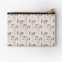 a small zipper pouch with flowers and leaves printed on the front, in white background