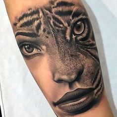 a woman's arm with a tiger face tattoo on the left side of her body