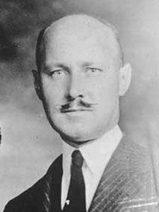 an old black and white photo of a man with a mustache