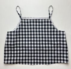 a black and white checkered apron with straps