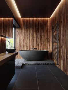 a large bath tub sitting in the middle of a bathroom next to a wooden wall