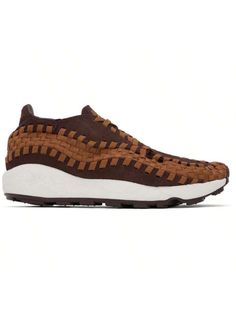 Nike 
Brown Air Footscape Woven Sneakers 
Low-top suede and webbing sneakers in brown. 
. Asymmetrical construction 
. Lace-up closure 
. Logo embroidered at tongue 
. Logo embroidered padded heel counter 
. Nike Air cushioning at heel 
. Unlined 
. Foam rubber midsole 
. Treaded rubber sole 
Please note that this item may be shipped only within North America. 
Supplier color: Earth/Light British tan 
Upper: leather, textile. Sole: rubber. 
Made in Indonesia. 
241011M237139 
Brown Air Footscape Brown Sporty Sneakers With Air Cushioning, Outdoor Brown Cushioned Sneakers, Brown Outdoor Sneakers With Textured Tread, Brown Rugged Breathable Sneakers, Masculine Brown Sneakers With Textured Sole, Casual Athletic Shoes, Nike Brown, Outdoor Bag, Casual Sneakers Women