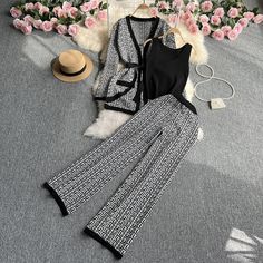 This two-piece knitted top and wide leg pants set offers a comfortable and stylish option for any occasion. The soft, stretchy material of the top and pants provides a flattering fit, while the wide leg design adds a touch of sophistication. - Color: Brown, Black, Grey- Style: Two-Piece Top + Pants- Pattern Type: Geometric- Sleeve Length: Long Sleeve and Sleeveless- Neckline: V-neck- Pants Length: Full Length- Fabric: Polyester - Details: Lace Up- Occasion: Casual- Gender: Women- Size: One Size Top And Wide Leg Pants, Geometric Sleeve, Grey Style, Knitted Top, Leg Design, Pants Length, Pants Pattern, Grey Fashion, Stretchy Material