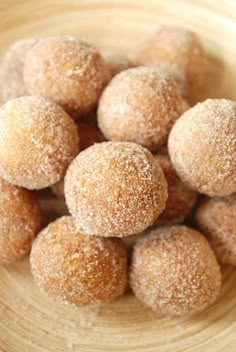 sugar coated donuts in a wooden bowl