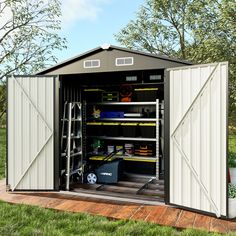 an outdoor storage shed with its doors open and tools in the bins on the floor