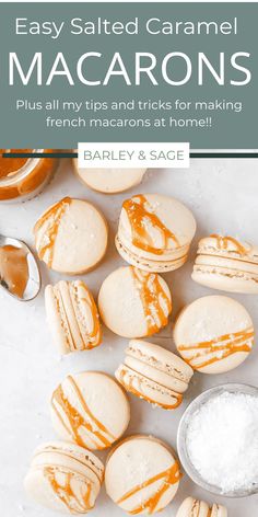 some macarons are sitting on a table with salt and spoons