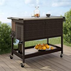 an outdoor bar cart with oranges on it