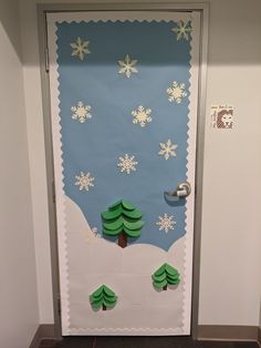 a door decorated with paper snowflakes and trees