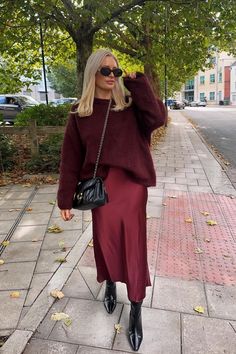 Fall 2024 Burgundy Outfits, All Maroon Outfit, Maroon Jumper Outfit, Outfits With Red Skirts Winter, Red Satin Skirt Christmas Outfit, December Fashion Outfits, Mom Style Winter Outfit Ideas, Sweater Slip Skirt Outfit, Christmas Markets Outfit Ideas