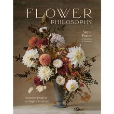 the cover of flower photography magazine with flowers in a vase on a white tablecloth