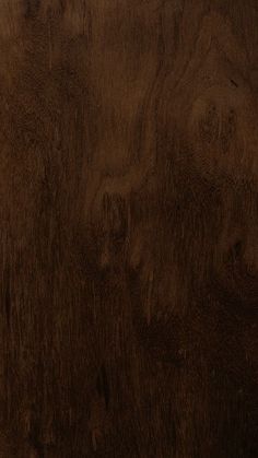 a close up view of the wood grains on this wooden flooring material, which looks like it has been stained dark brown