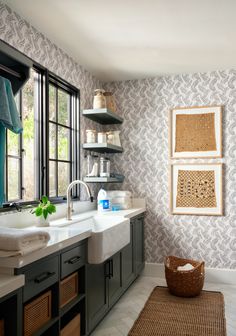 a bathroom with a sink, window and rug