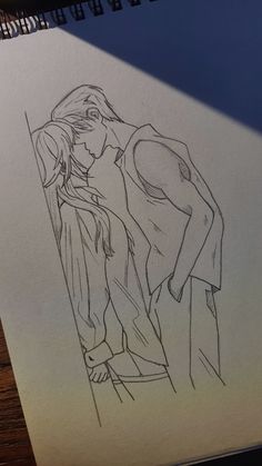 a drawing of two people standing next to each other on top of a piece of paper