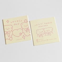 two small business cards with pink ink on them, one has an elephant and the other says lovely day