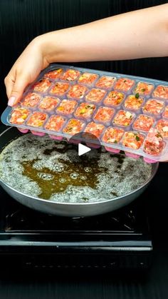 someone is placing food in a pan on top of the stove to cool it down