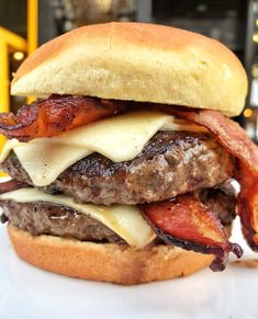 a bacon and cheese burger on a bun