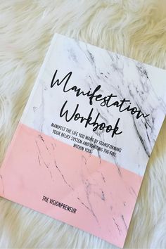 a book that is laying on top of a fur rug with the title, mastering workbook